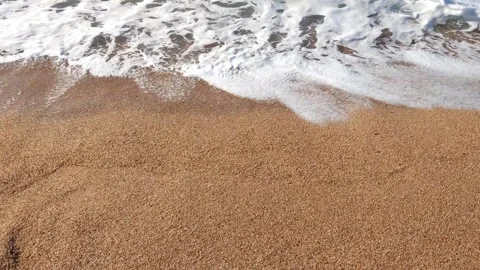 Serene Ocean Wave Gently Lapping on Golden Sandy Beach Stock Footage 295891541