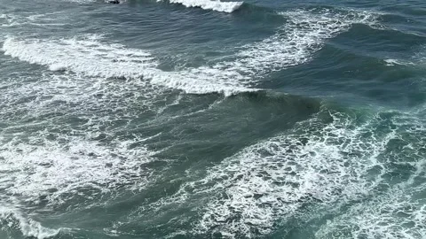 Serene ocean waves gently lapping against the shore Stock Footage 286729233