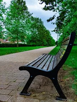 Serene Park Path with Bench Stock Photos
