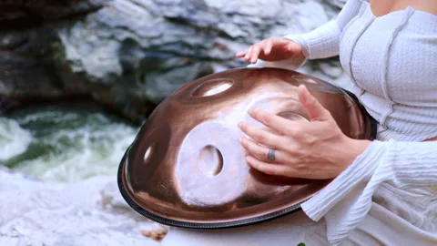 A Serene Performance: Capturing the Harmony of Nature and Music as Hands Stock Footage 315239367