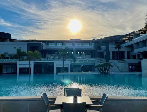 Serene Poolside View at Sunset Stock Photos