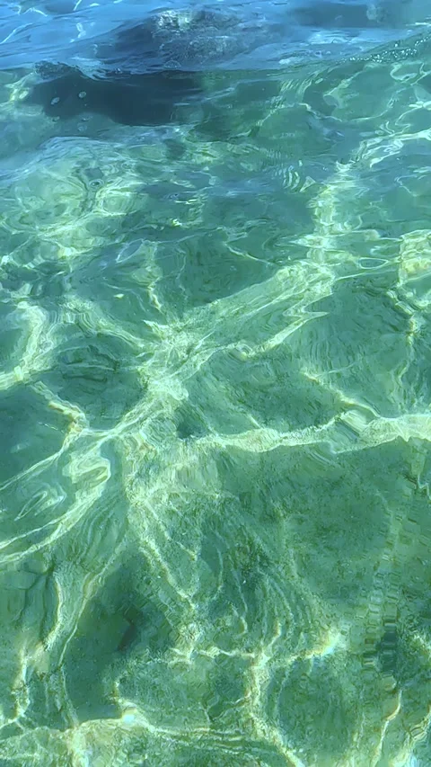 A Serene Reflection of Crystal Clear Waters Capturing the Beauty Beneath, Stock Footage 330097336