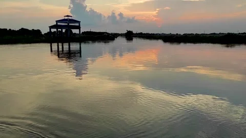 Serene river confluence in Bengal at sunset with reflection and calm water Stock-Footage 333893466