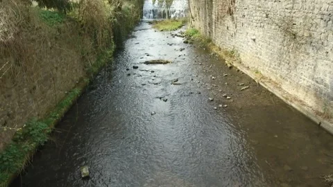 Serene River Flow Through a Peaceful City Stock Footage 307896901