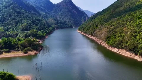 Serene River Flowing Through Lush Green Mountain Landscape China Stock Footage 346336149