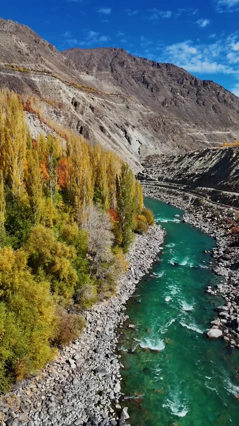 Serene river journey from vertical drone eye in Kargil during autumn season. Stock Footage 310665237