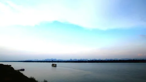 Serene River Landscape at Dawn, Boats Silhouetted Against Skyline Stock Footage 310817455