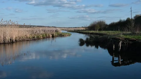 A Serene River Meanders Peacefully Through a Picturesque Natural Landscape,.. Stock Footage 333343832