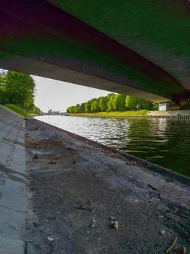 Serene river view under a bridge 스톡 사진