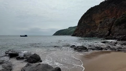 Serene Rocky Coastline with Waves Stock Footage 291393008