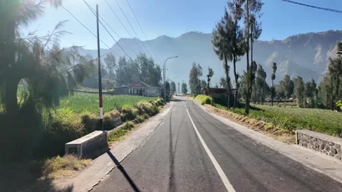Serene rural road winds through a tranquil countryside Stock Footage 345194924
