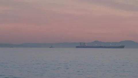 Serene Scene - Boundless Ocean at Sunset - Oil Tanker in the Background Video stock 171401228