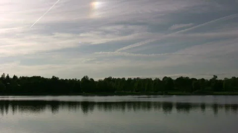 Serene scene of quiet lake, reflecting the treeline (High Definition) Stock-Footage 364853