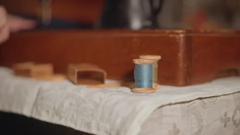 Serene scene with textured tools. Tranquil setting highlighting vintage sewing Stock Footage 346549930
