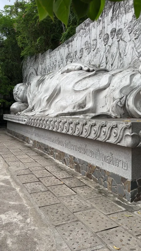 Serene sculpture of a sleeping Buddha Stock Footage 314284156