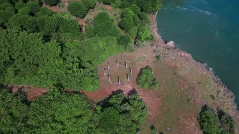 Serene seaside cliff with ancient foundations and modern survey tools Stock-Footage 337132828