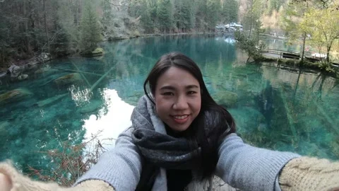 Serene Selfie by a Tranquil Lake Surrounded by Nature Stock Footage 314616582