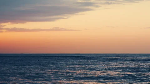 Serene slow motion ocean horizon at golden hour dusk Stock-Footage 343380218