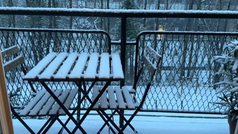 Serene Snow-Covered Balcony with Table and Chairs in Winter Landscape Stock Footage 328069799