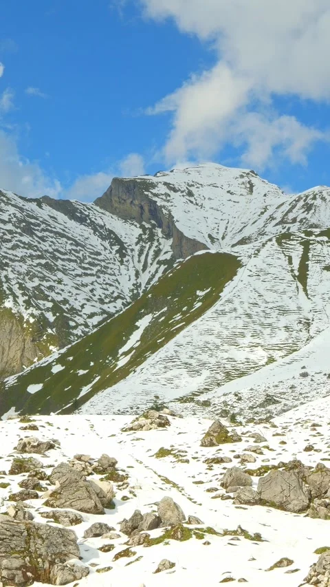 Serene Snow-Covered Cliffs and Blue Horizon in the Oberallgau Mountains near Video stock 308296388