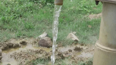 Serene Spring - Trickling Water from a Hand Pump Stock Footage 320933006