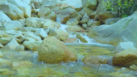 Serene Stream Flowing Through Rocky Terrain | Calming Nature Sounds Stock Footage 286933924