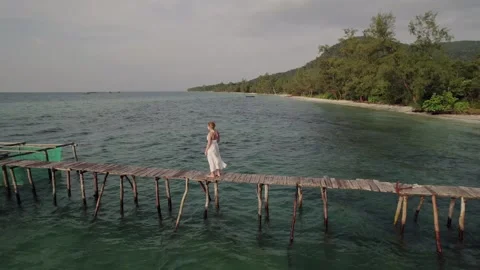 Serene Summer Stroll, Seaside Pier Solitude Stock Footage 260598645