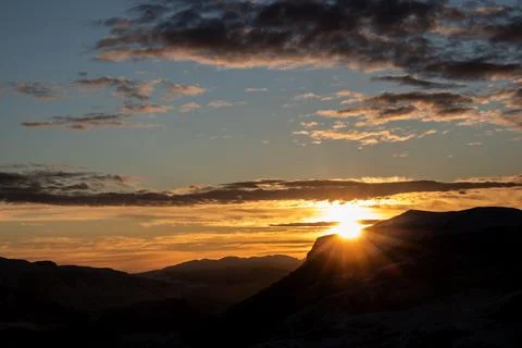 Serene Sunrays Over the Mountain Stock Photos