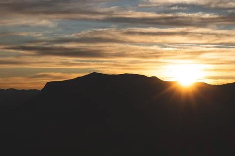 Serene Sunrays Over the Mountain Stock Photos