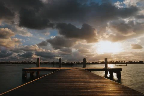 Serene Sunset on the Dock Stock Photos
