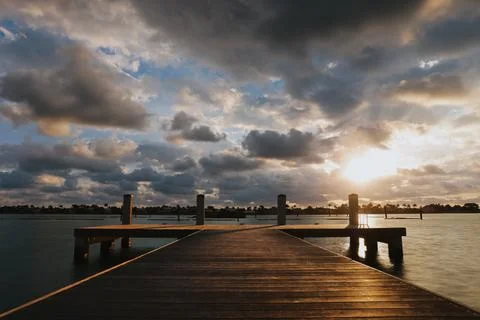 Serene Sunset on the Dock Stock Photos