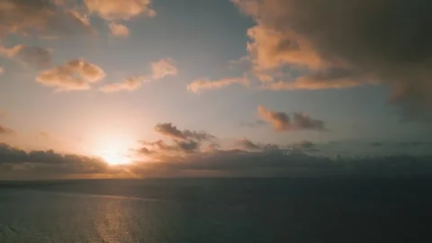 Serene sunset glow above calm ocean waters Stock Footage 345681376