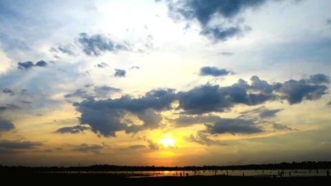 Serene Sunset Landscape with Dramatic Cloud Formations Stock Footage 311587043