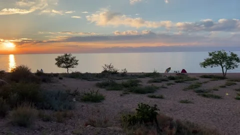 A Serene Sunset over a Beautiful Tranquil Beach Landscape that Inspires Thoughts Stock Footage 281558586