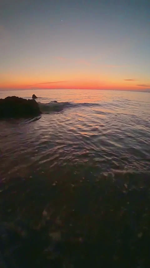 Serene Sunset Over Ocean Waves. Stock Footage 305979741