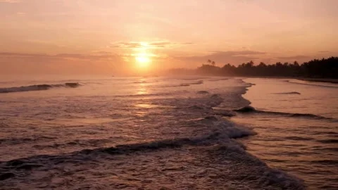 Serene Sunset Over Ocean Waves at Tropical Beach Stock Footage 310649005