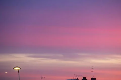 Serene Sunset Over Rooftops Fotos de archivo
