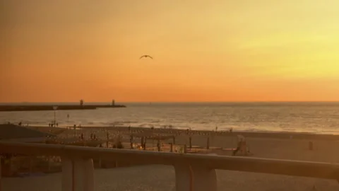 Serene Sunset Over Tranquil Beach with Gentle Waves and Peaceful Atmosphere Stock Footage 295995419