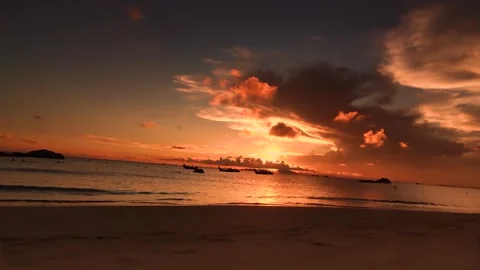 Serene Sunset Over Tropical Ocean Waters With Silhouetted Fishing Boats At Dusk Stock Footage 342209200
