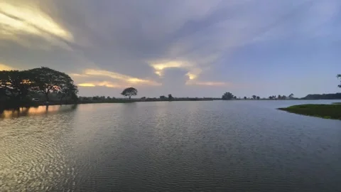 Serene Sunset Reflection Over Calm Lake Nature Landscape Tranquil Environment Stock Footage 307817833