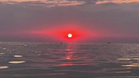 Serene Sunset Reflections on Calm Sea Stock Footage 264013432