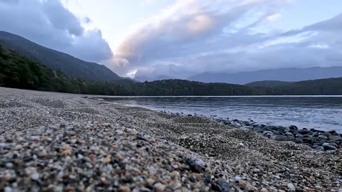 Serene Sunset Reflections at Lake Te Anau: A Scenic Great Walk in Fiordland.. Stock Footage 295242480
