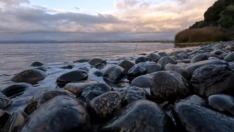 Serene Sunset Reflections at Lake Te Anau: A Scenic Great Walk in Fiordland.. Stock Footage 295242513