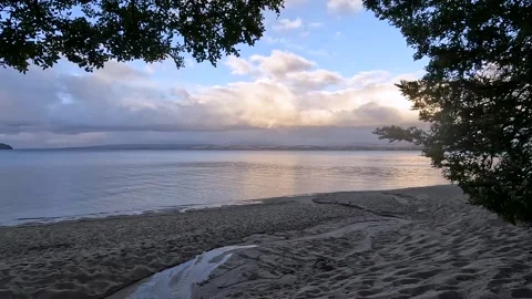 Serene Sunset Reflections at Lake Te Anau: A Scenic Great Walk in Fiordland.. Stock Footage 295242514