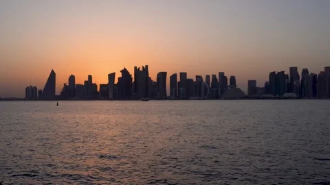 Serene Sunset Silhouette of the Doha Skyline Stock-Footage 336565477