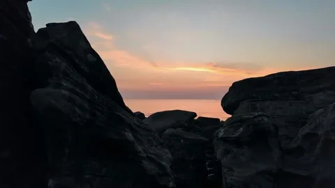 Serene Sunset Silhouette over Tranquil Waters Stock Footage 259255577