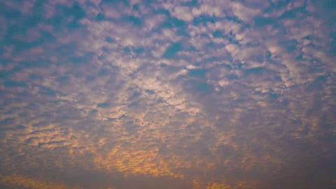 Serene sunset sky with altocumulus clouds drifting slowly over the horizon Stock Footage 341956957