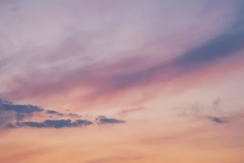 Serene Sunset Sky with Soft Clouds Stock Photos
