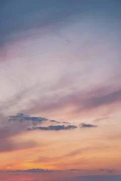 Serene Sunset Sky with Soft Clouds Stock Photos