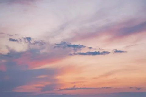 Serene Sunset Sky with Soft Clouds Stock Photos